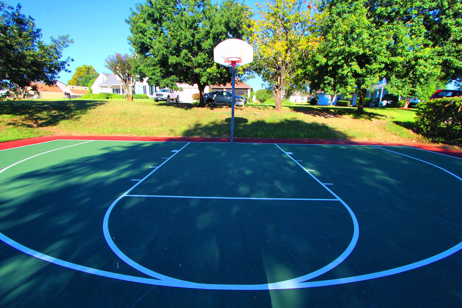 A colorful outdoor basketball court at VRI's The Landing at Seven Coves in Willis, Texas.